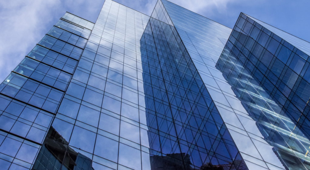 Image of Sky Rise Building with persepective looking upward towards sky.
